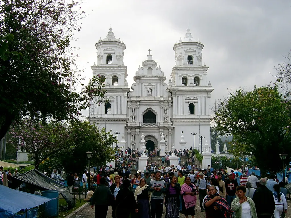 Frontal view of Basilica in Esquipulas, Guatemala on January 14, 2005 - a day before the holiday of Black Christ. During this holiday, he city is crowded by visitors. Some women wear traditional Mayan costumes. Blue tents on both sides of the main path are occupied by poor pilgrim families, which cannot afford a hotel. This picture is my own work (--Sapfan 17:48, 17 July 2006 (UTC)) and was previously published on http://railtrips.euweb.cz/c_sal_foto1_en.html .