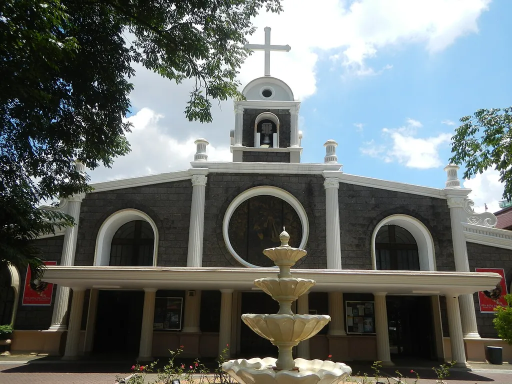 Santa Rita de Cascia Parish Church (Philam Homes, Quezon City) Laying of Cornerstone January 6, 1956 Inaugurated June 2, 1957, Dedicated December 1999 and Solemnly Consecrated December 30, 1993 Bishop Pedro N. Bantigue, D.D. Hall Roman Catholic Diocese of Cubao List of barangays of Metro Manila, Legislative districts of Quezon City District I, Barangays of Quezon City Philam, beside Bungad District 1, Quezon City; along EDSA List of roads in Metro Manila (Note: Judge Florentino Floro, the owner, to repeat, Donor Florentino Floro of all these photos hereby donate gratuitously, freely and unconditionally all these photos to and for Wikimedia Commons, exclusively, for public use of the public domain, and again without any condition whatsoever).