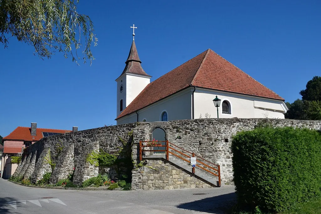 The catholic parish church hl. Michael with the war memorial and the wall in Michelbach, Lower Austria, is protected as a cultural heritage monument.