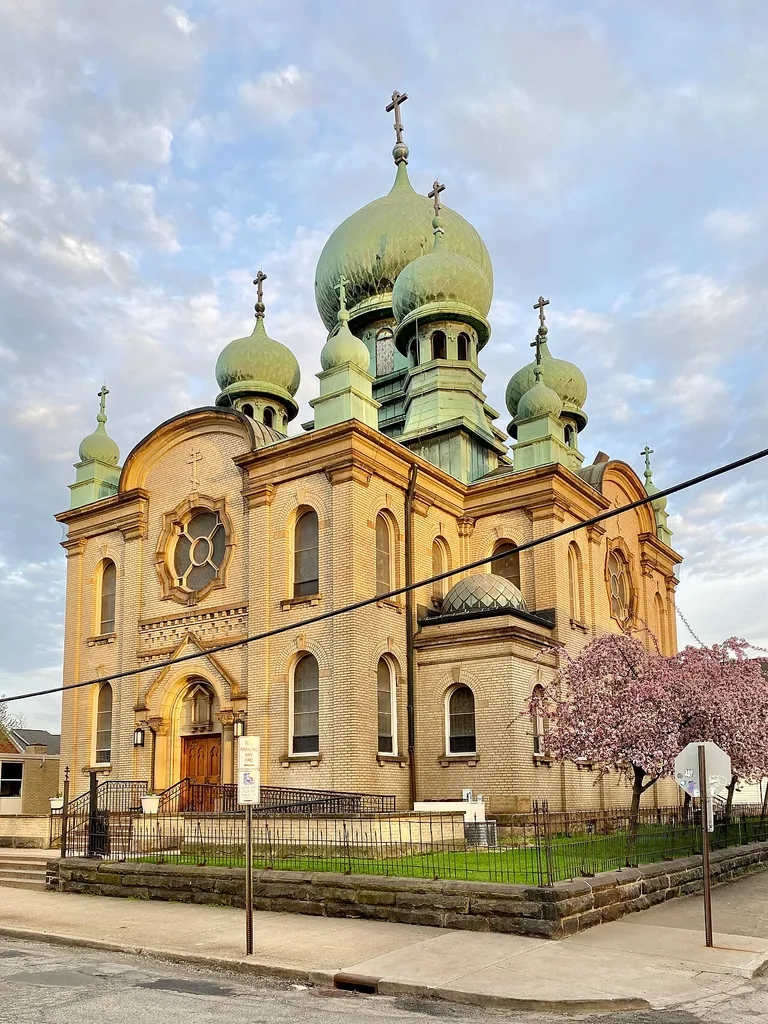 St. Theodosius Russian Orthodox Cathedral and its many Onion Domes tower over Interstate 490 and Starkweather Avenue in Cleveland’s Tremont neighborhood. Constructed in 1911, the Neo-Byzantine Revival-style building was designed by architect Frederick C. Baird and houses a congregation that was formed in 1896 by Russian immigrants whom had settled in Cleveland. Consecrated in 1913, the church has long been a center of the Russian community in the city, and landmark on the city’s west side, with thirteen onion domes representing Jesus Christ and his twelve apostles towering above the relatively restrained, Renaissance-inspired yellow-brick structure that is built in a Greek cross shape, a typical form taken by Orthodox Churches. Rededicated in 1954 after hosting several Sobors, a council of the Russian Orthodox Church used to decide on important matters within the church, owing to its large size and central, easily accessible location. The building was listed on the National Register of Historic Places in 1974, and remains one of the most iconic and unique structures in Cleveland, a testament to the city’s religious, ethnic, and cultural diversity, and its economic prowess during the early 20th Century.