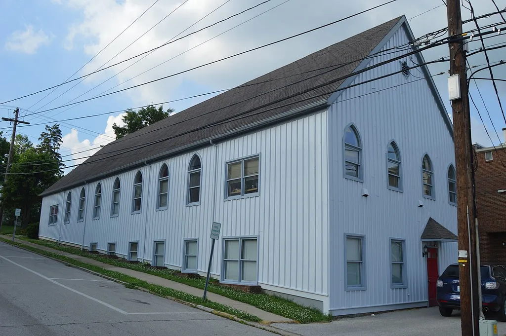 Western side and rear of the Church of the Ascension, located on High Street at Broadway in Mount Sterling, Kentucky, United States. Built in 1878, it is listed on the National Register of Historic Places, and it is part of a Register-listed historic district, the Mount Sterling Commercial District.