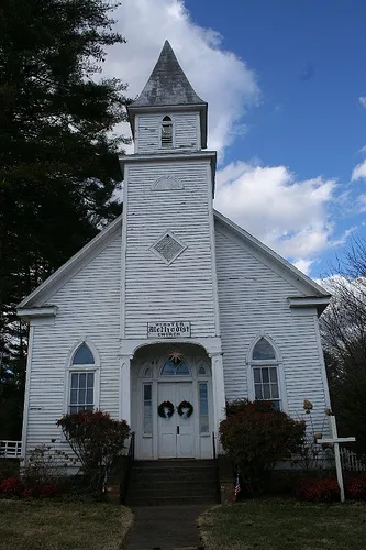 The Webster Methodist Church, built in 1887, as it appeared around Christmas, 2005. It is located in Webster, North Carolina, and is an historic building, located next to the old town WPA Rock School, built in 1936.