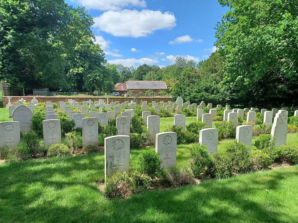 The Canadian military cemetery in the churchyard of St. Mary the Virgin's Church, Bramshott, Hampshire. The cemetery contains the remains of hundreds of Canadians who died during the First World War, many of them succumbing to Spanish Flu.