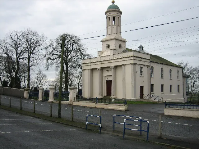 Castlereagh Presbyterian Church. The Congregation was founded in 1650. The present church building, erected in 1835 was designed by Belfast architect John Millar, in a Greek Revival style and was possibly the second or third building on this site. It was the first Presbyterian church in Ireland to have a bell tower, and its commanding site makes it conspicuous from many parts of the city. The Ionic detail has helped to ensure that the building now has an Historical Listing as 'A Building of Special Architectural and Historic Interest'.