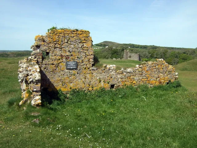 Pennard: ruined church and castle Unusual hazards on a golf course are the remains of Pennard castle standing right on the edge of the valley, and a little distance away is this ruined mediaeval church which, like the castle and the settlement around it, was overwhelmed by wind-blown sand and was last used in 1532.