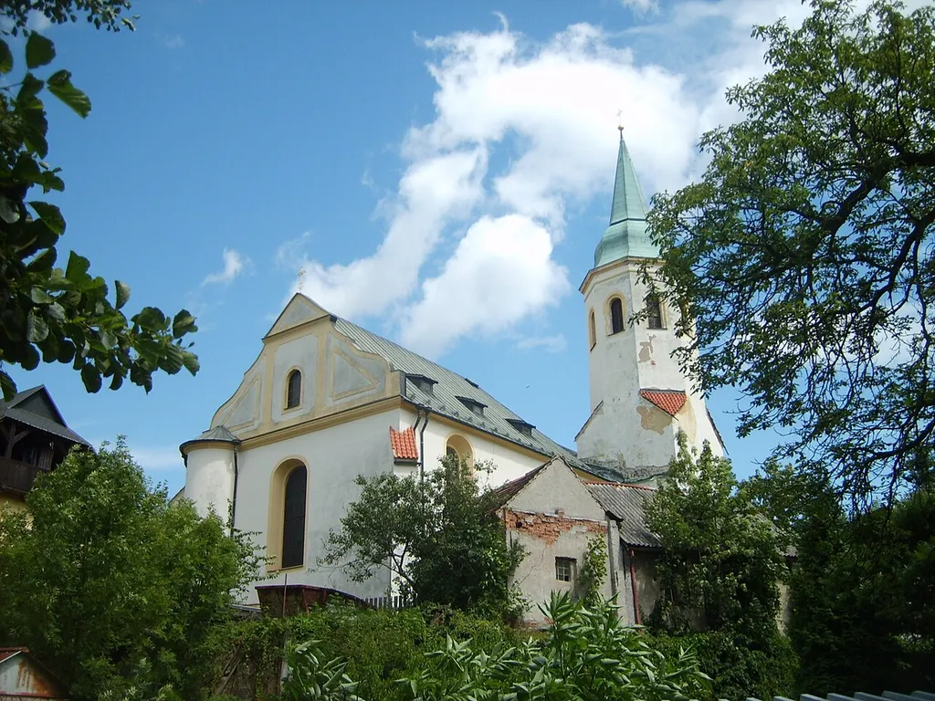 Church on "Small square" in Ostrov nad Ohří looked from chateau garden.