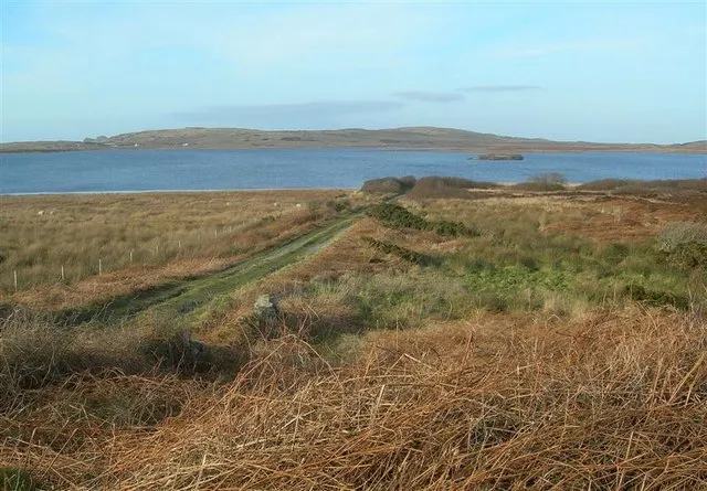 Loch Gorm Track This is one of the access points for fishermen. The barely visible island on the Loch is Eilean Mòr, on which are located the (even less visible) ruins of Loch Gorm Castle