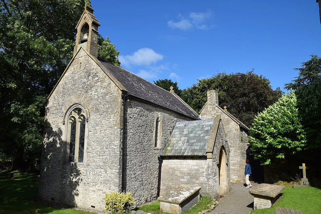 Burnett Church (St. Michael), 7 August 2016. Some sources state that it is Early English 13th Century but others state that it is Norman (1105) and I favour the latter - the west window is Perpendicular but within a round headed arch which looks typical Norman.