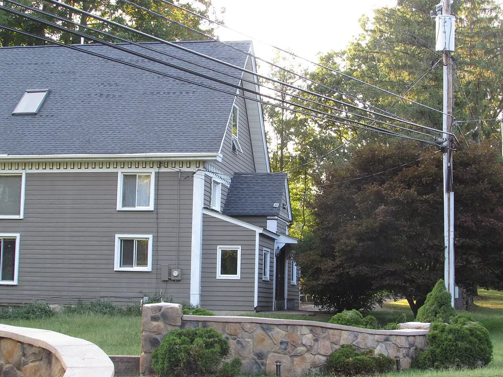 The gabled entrance of the former Wesley M. E. Church in McClellandville. Most of the original decoration has been removed except for the cornice.