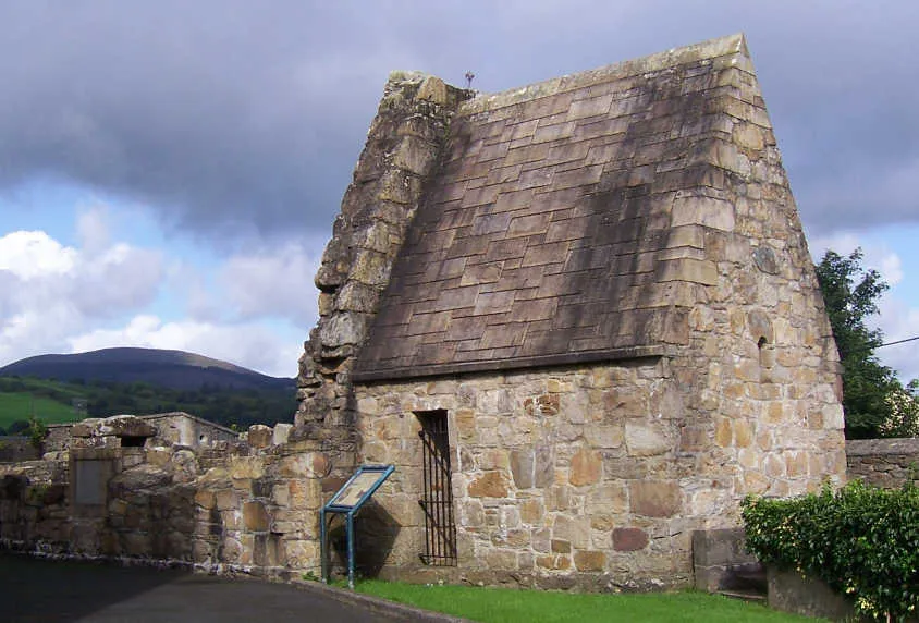 St Lua's Church. Moved from Friar's Island in the Shannon below Killaloe to the grounds of the Catholic Church when the island was flooded in the 1920's.