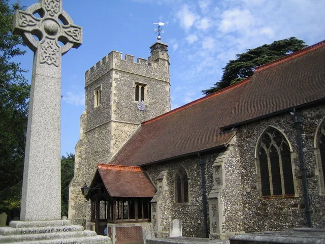 Harlington: The Church of St Peter &amp; St Paul. Situated off St Peter's Way, there has been a church on this site since 1086 as the vicar is mentioned in the Domesday Book. On the left is the War Memorial.