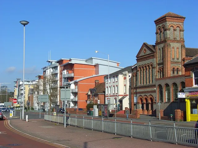 King's Road, Reading, Berkshire. This is the scene at "Cemetery Junction", where the A329 and A4 cross. The Italianate building is a Wycliffe Baptist Church. The small brick building is the Arthur Hill swimming pool.