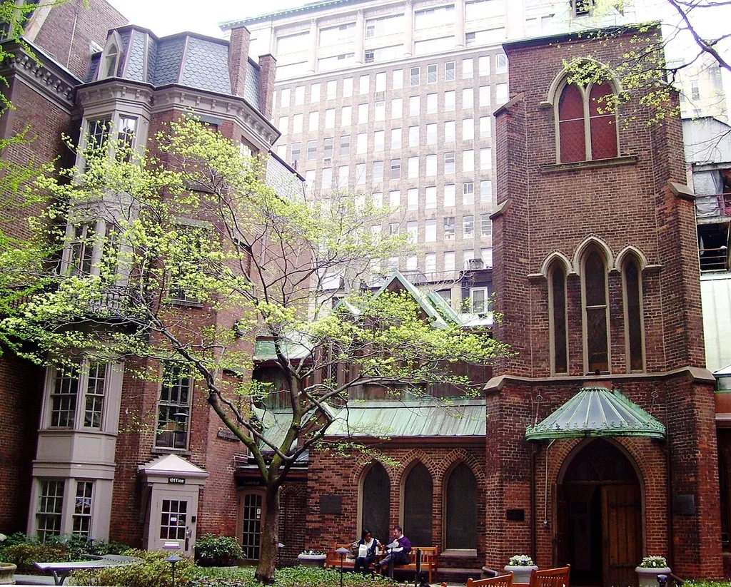 The west end of the courtyard of the Church of the Transfiguration, better known as the Little Church Around the Corner, at 1 West 29th Street between Madison and Fifth Avenues in the NoMad neighborhood of Manhattan, New York City.