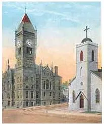 Wapello County Courthouse and St. Mary of the Visitation Catholic Church in Ottumwa, Iowa. The picture shows them as they appear before the church was torn down and replaced by the present church in the 1920s and the courthouse bell tower was removed in the 1950s.