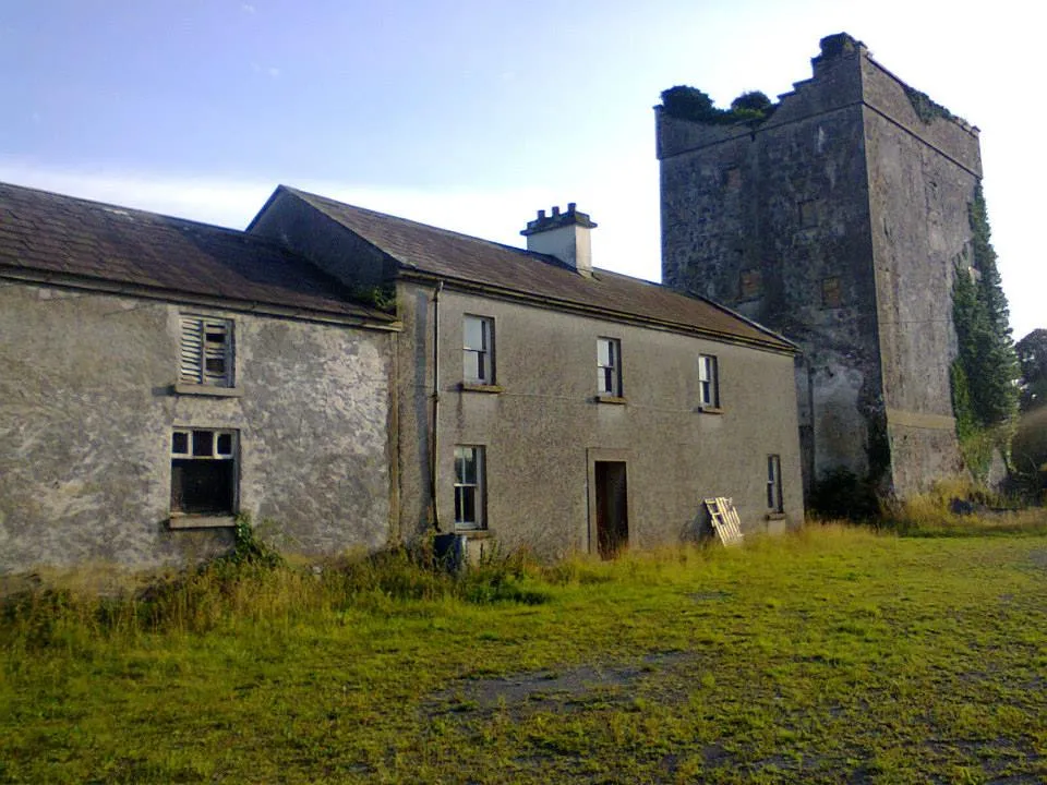Monivea Castle from the north east. The building to the right is the original Anglo-Norman tower house, while the main part of the later mansion, which was located to the north, south and west and was destroyed in the early 20th century, was built onto it (photograph taken 2013)