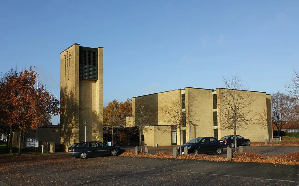 Simon Peter's church in Kolding, Denmark. It was inaugurated second September 1979 and is thus Kolding's newest church. The very minimalist style is performed by the architect Holger Jensen. Simon Peter's Church is located in an old apple orchard. The building itself is made of yellow hand-molded bricks and all the furniture is of pine. The sanctuary is a large main room and has a total of 375 seats.