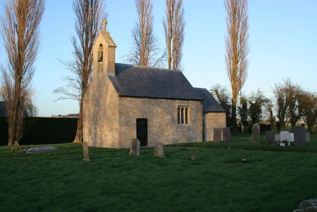 St Andrew's Church, Scott Willoughby The smallest church still in use in the county of Lincolnshire. It was rebuilt in 1826 and altered twice later in the 19th century. The chancel arch contains a stone with Anglo Saxon interlace carving which indicates its origins are much earlier.. The small nave has a single gabled bellcote and tiny chancel. The windows are simple with three lights under square heads. The door is planked with a segmental arch and keystone.