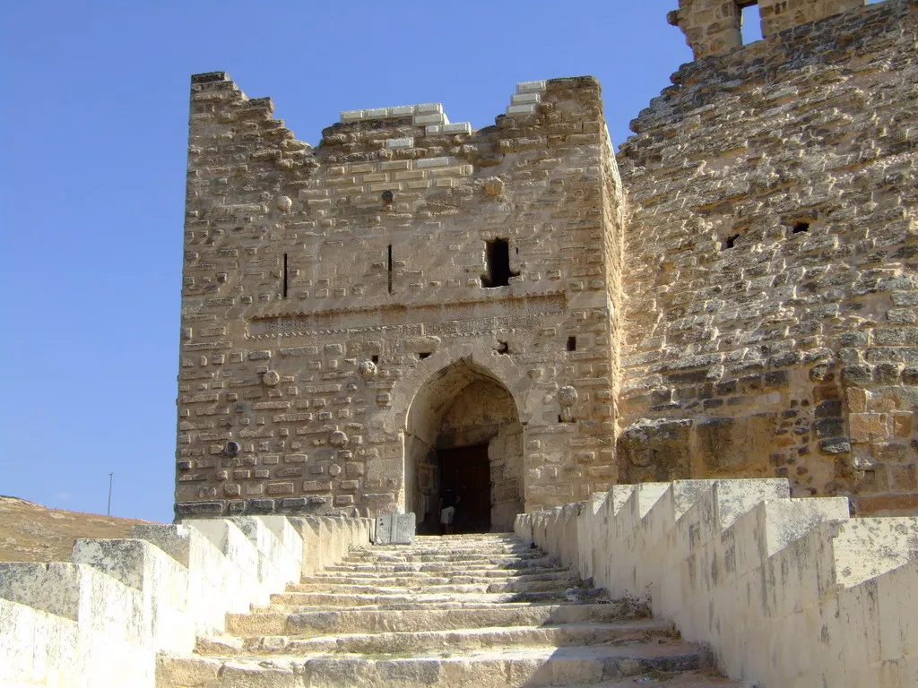 Qa'alat Shaizar Syria was a medieval town and fortress in Syria, ruled by the Banu Munqidh dynasty, which played an important part in the Christian and Muslim politics of the crusades. Located on the Orontes to the northwest of Hama, Shaizar was an ancient town, known as Senzar or Sezar in the Amarna letters. To the Greeks it was known as Sidzara, but the Seleucid dynasty renamed it Larissa, after the town of the same name in Thessaly from which many colonists came. It reverted to its earlier name under the Roman Empire and was known as Sezer under the Byzantine Empire. Shaizar fell to the Arabs in 638 and frequently passed from Arab to Byzantine control. It was sacked in 969 by Byzantine emperor Nicephorus II, and was captured by Basil II in 999, after which it became the southern border of the Byzantine Empire and was administered by the Bishop of Shaizar. It was lost to the Banu Munqidh in 1081 when 'Ali ibn Munqidh bought it from the bishop. The Byzantines besieged it numerous times after this but failed to recover it. The Crusaders, on their arrival in this area, rendered the city's name in Latin as Caesarea. This name had not been used in any earlier period, and was derived from the Crusaders mistakenly identifying this city as being Caesarea Mazaca, a place renowned in Christian history as the home of Saint Basil of Caesarea. It is no longer inhabited today, but the ruins are known as Saijar in modern Arabic. Munqidhite Shaizar The Munqidhites controlled territory east of Shaizar, across the al-Ansariyah mountains to the Mediterranean coast, from the coastal cities of Latakia in the north to Tortosa in the south. During the First Crusade, the emir assisted the crusaders passing through his land, giving them horses and food and other provisions. After the crusade it was bordered by the crusader Principality of Antioch and was subject to raids from both Antioch and the County of Tripoli; in 1106 the emirs Murshid and Sultan defeated William-Jordan of Tripoli, a