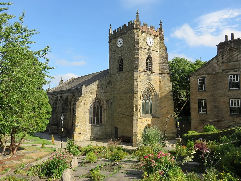 Church of St Thomas the Martyr at Up Holland, Lancashire. The building to the right is Up Holland Village Club.