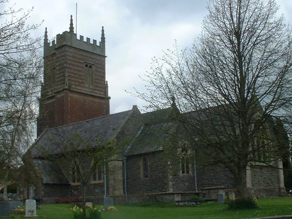 Church at Clutton Taken by Rod Ward 27th April 2006. The church is dedicated to St Augustine of Hippo. It dates from around 1190, but has had several major restorations. The tower is made of red sandstone with diagonal buttresses ending in pinnacles and probably dates from 1726. The tower contains two bells dating from 1734, made by Thomas Bilbie of the Bilbie family. The church is a Grade II* listed building. Two railed tomb enclosures within the Broadribb family plot are also listed as Grade II, as are a group of three Broadribb and Purnell monuments. The church is currently under a small amount of renovation.