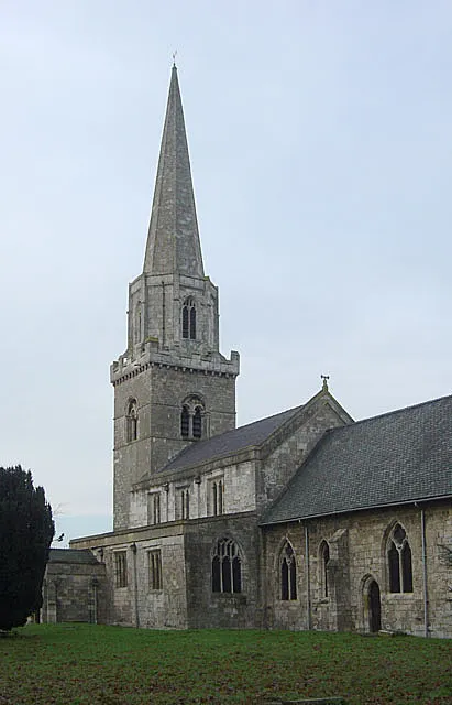 Brayton Church from the south-east, near to Brayton, North Yorkshire, Great Britain. This view shows the principal stages of development, including the Normal main tower (c.1100), Decorated (14C) chancel and Perpendicular (15C) upper tower and spire, south aisle and clerestory.