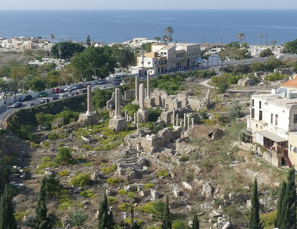 The ruins of the Crusader Crowning Cathedral in Tyre/Sour, Lebanon, with some remains of the Fatimid Grand Mosque upon which it was built (central foreground), the Shiite cemetery in the background (central) and the Christian cemetery in the background (left)