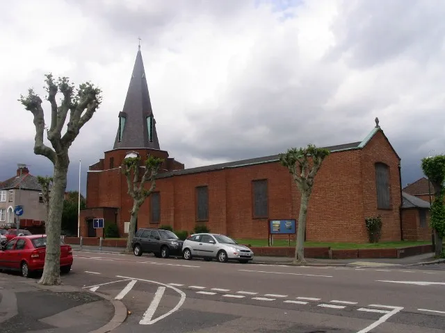 St George's parish church, Barkers' Butts Lane, Coundon, Coventry, seen from the south.The foundation stone, the white block at the base of the tower, reads, "To the glory of God this stone was laid by the Lord Iliffe CBE 27th November 1938, WB Wilson, Vicar, DA Drane, A Blakeman, Churchwardens".