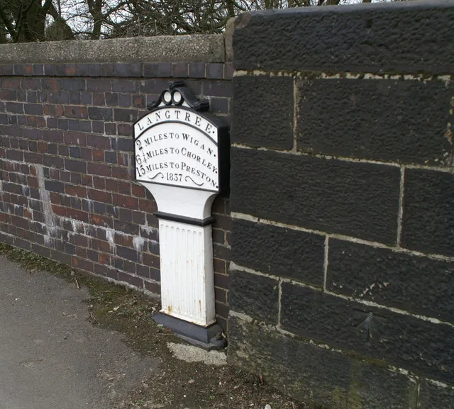 Milepost on the A49 at Boars Head, Standish with Langtree