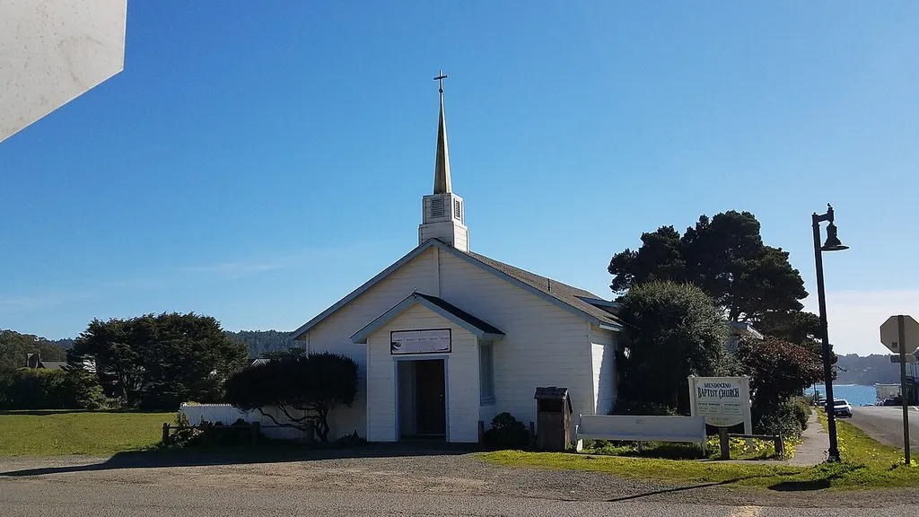 Image of church sign and entrance on south side of Little Lake Street