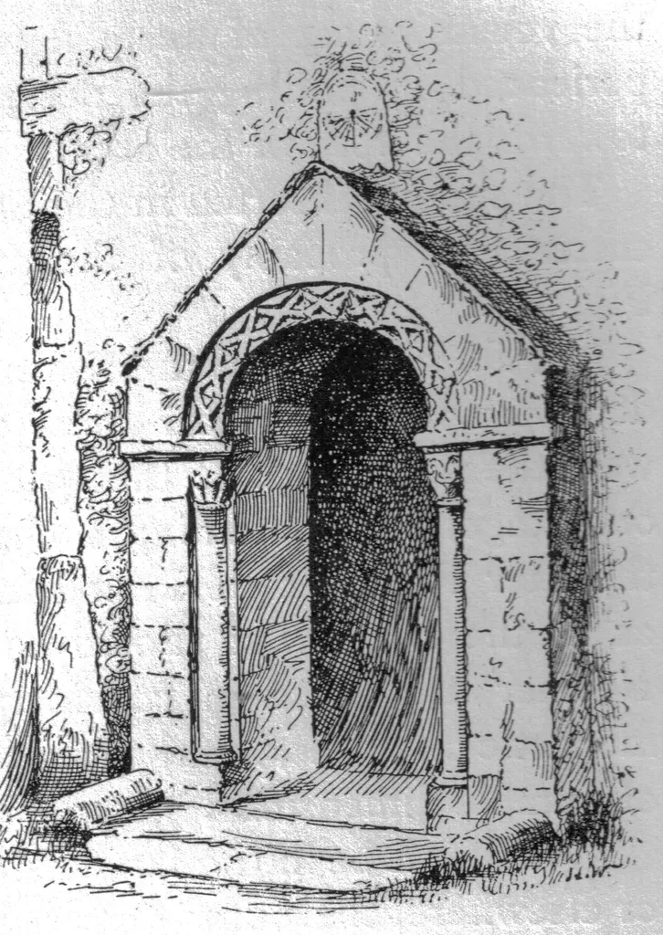 Church of England parish church of St Andrew, Bishopstone, East Sussex: Mass dial and Norman porch.