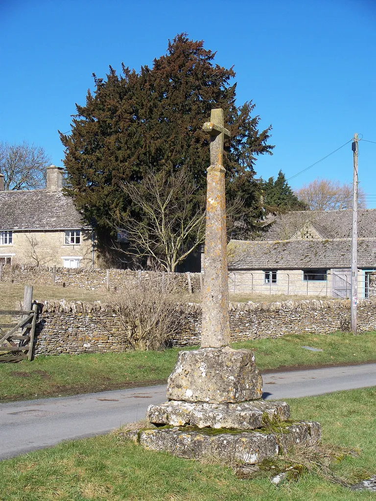 Cross, Condicote An attractive village in the centre of an area rich in history and historical remains. "On the western side of the green is a spring marked by a cross of which the basethree steps and a socketsurvive from the late 14th century. A new shaft and finial-cross were added in 1864. The finial-cross was later destroyed and was replaced in 1888 by one from the western gable-end of the church. The reputation of the spring as a holy well is thought to be a possible cause for the location of Condicote Camp. Certainly the spring made possible the settlement of the village, whose chief supply it was until the mid-20th century. Beneath the base of the cross, perhaps contemporary with it, was a cistern or dip-well, which by 1868 was fitted with a pair of doors. The supply was evidently then in some danger of contamination, and before 1926 the cistern was sealed off and a pump took its place. From before 1700 until about the mid19th century the spring filled a pond on the south side of the green. By 1882 the pond also was replaced by a pump, and a pump still marked the site in 1960. A main water supply, however, was brought to the village in 1937." From: 'Parishes: Condicote', A History of the County of Gloucester: volume 6 (1965), pp. 63-72.