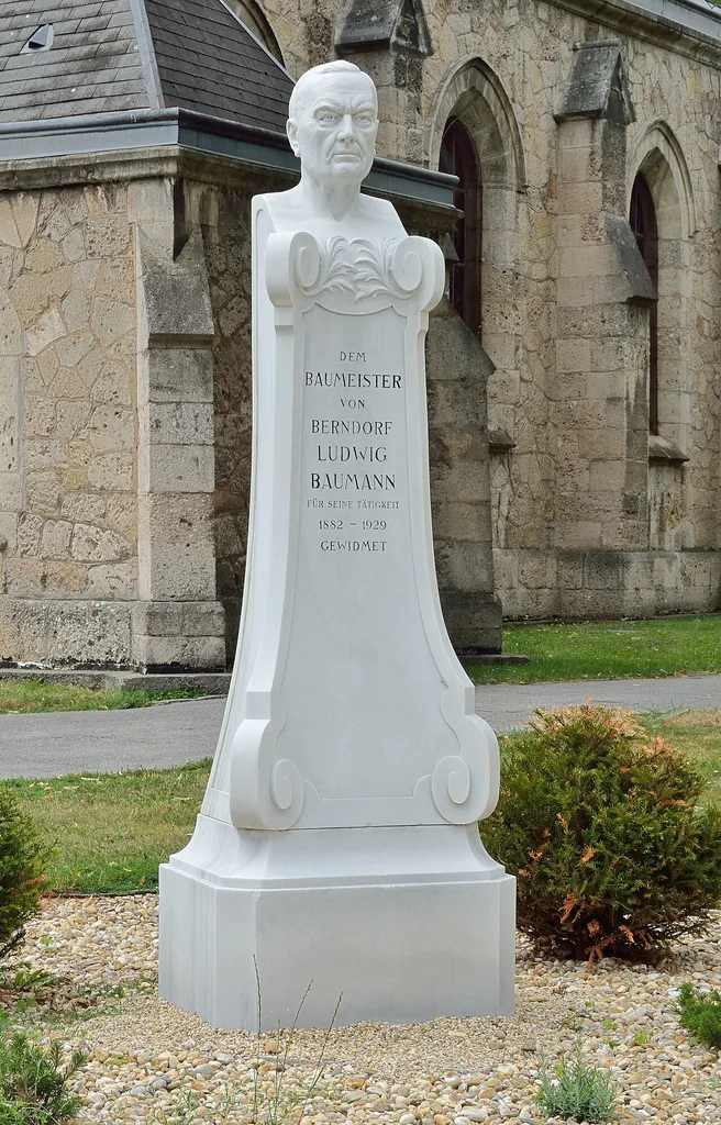 Bust of Ludwig Baumann, Austrian architect and main city planer of Berndorf, Lower Austria. The bust was located behind the parish church St. Margareta in Berndorf till 2016 and then was moved to the Theaterpark. The monument was initiated by Klaus von Bohlen in 1939.