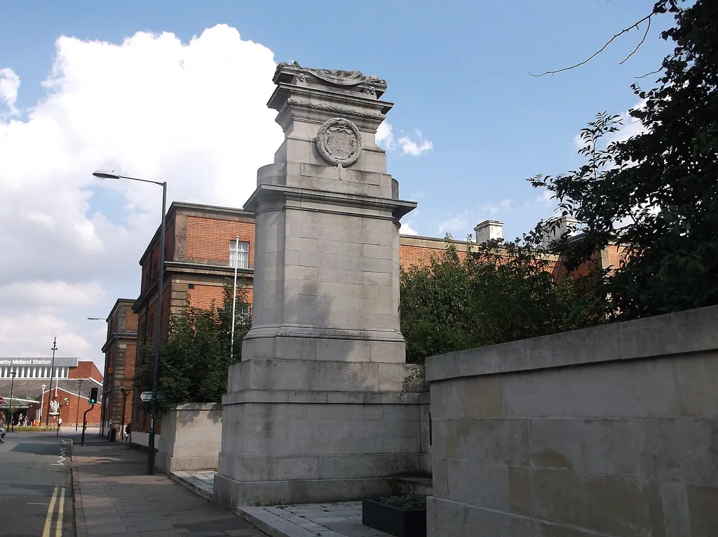 Midland Railway War Memorial. This impressive memorial, made from Portland Stone, stands on Midland Street in Derby, a short distance from Derby Midland station and is a grade II* listed building, but sadly seems to be mostly overlooked. The inscription reads "To the brave men of the Midland Railway who gave their lives in the Great War". Brass plaques either side of the cenotaph record the names of those men.