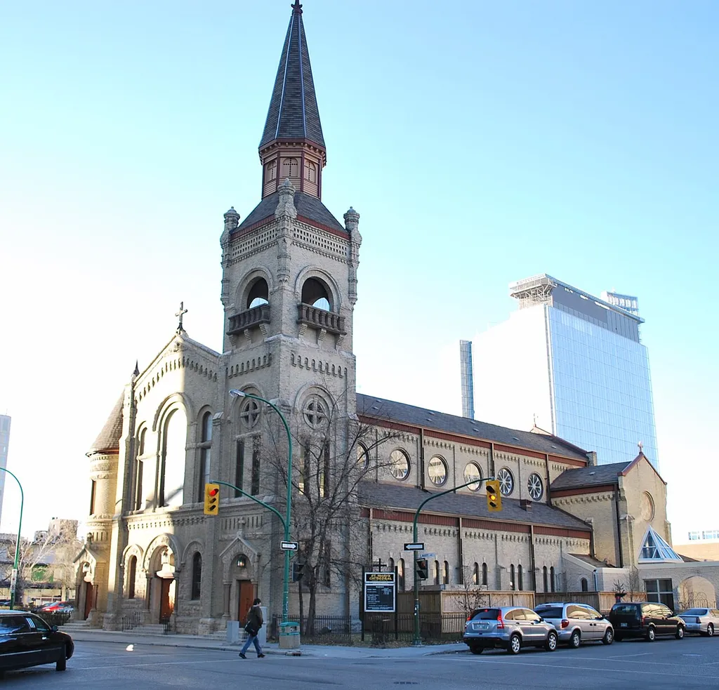 St. Mary's Roman Catholic Cathedral,Winnipeg, Manitoba. In the distance is the new Manitoba Hydro Tower.