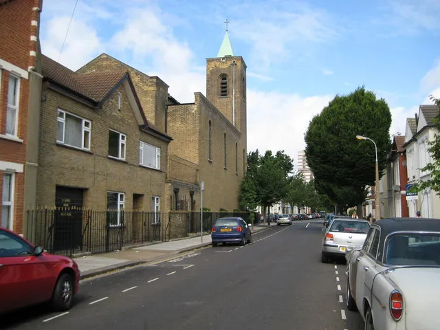 Fulham: Catholic Church of Our Lady of Perpetual Help This is the view down Tynemouth Street towards the Church, although the main entrance is past the tower and around to the left in Stephendale Road. The Church was built in 1922 to the designs of the catholic Priest Fr Benedict Williamson, and was funded by a lady in memory of her son who was killed in 1914 during the First World War. Some of the internal architecture is of an Egyptian style reflecting the contemporary interest in all things Egyptian around that time, when the Tomb of Tutankhamun had just been discovered by Howard Carter.