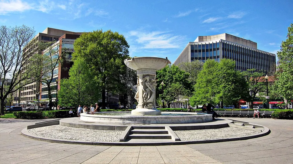 The Dupont Circle fountain, located at the center of Dupont Circle in Washington, D.C. Designed by Henry Bacon and sculpted by Daniel Chester French, the marble fountain is in honor of Rear Admiral Samuel Francis Du Pont. The fountain's shaft features carvings of three classical nudes symbolizing the sea, the stars, and the wind. Sculpted in 1921, the fountain is designated a contributing property to the Dupont Circle Historic District, listed on the National Register of Historic Places in 1978.