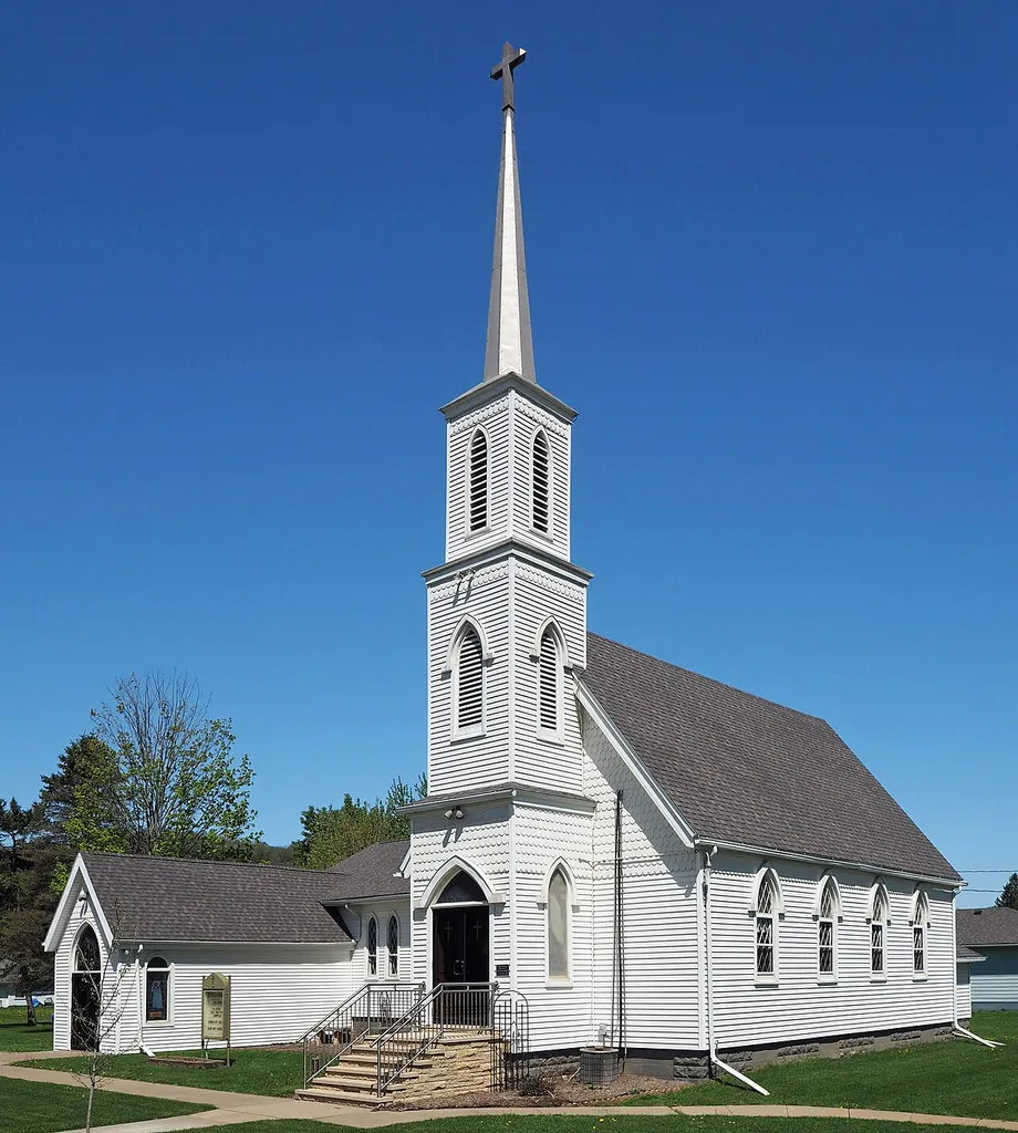 Grace Evangelical Lutheran Church (formerly Trinity Episcopal Church), Stockton, Minnesota, USA. Viewed from the southeast. This is an image of a place or building that is listed on the National Register of Historic Places in the United States of America. Its reference number is 84001727 (Wikidata).