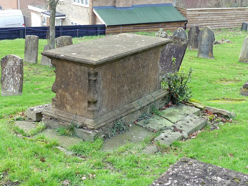Grade II listed chest tomb in Southam, Warwickshire. Listed as "Chest tomb approximately 6 metres south west of south west corner of south aisle of Church of St James". .mw-parser-output .messagebox{margin:4px 0;width:auto;border-collapse:collapse;border:2px solid var(--border-color-progressive,#6485d1);background-color:var(--background-color-neutral-subtle,#fbfcff);color:var(--color-base,#202122);box-sizing:border-box;border-inline-start-width:8px}.mw-parser-output .messagebox.mbox-small{font-size:88%;line-height:1.25em}.mw-parser-output .mbox-warning,.mw-parser-output .mbox-speedy{border:2px solid var(--border-color-error,#b22222);background:var(--background-color-error-subtle,#ffdbdb);border-inline-start-width:8px}.mw-parser-output .mbox-serious,.mw-parser-output .mbox-delete,.mw-parser-output .mbox-stop{border:2px solid var(--border-color-error,#b22222);border-inline-start-width:8px}.mw-parser-output .mbox-issue,.mw-parser-output .mbox-content{border:2px solid #f28500;background:var(--background-color-warning-subtle,#ffe);border-inline-start-width:8px}.mw-parser-output .mbox-query,.mw-parser-output .mbox-style{border:2px solid #f4c430;background:var(--background-color-warning-subtle,#ffe);border-inline-start-width:8px}.mw-parser-output .mbox-shit{border:2px solid #960;border-inline-start-width:8px}.mw-parser-output .mbox-license{border:2px solid #88a;border-inline-start-width:initial}.mw-parser-output .mbox-legal{border:2px solid var(--border-color-notice,#666);background:var(--background-color-base,#fff);border-inline-start-width:8px}.mw-parser-output .mbox-honor{border:2px solid #ca3;background:var(--background-color-warning-subtle,#fcf4db);border-inline-start-width:8px}.mw-parser-output .mbox-growth{border:2px solid #8d4;background:var(--background-color-success-subtle,#d5fdf4);border-inline-start-width:8px}.mw-parser-output .mbox-move{border:2px solid #93c;border-inline-start-width:8px}.mw-parser-output .mbox-protection,.mw-parser-output .mbox-message{border