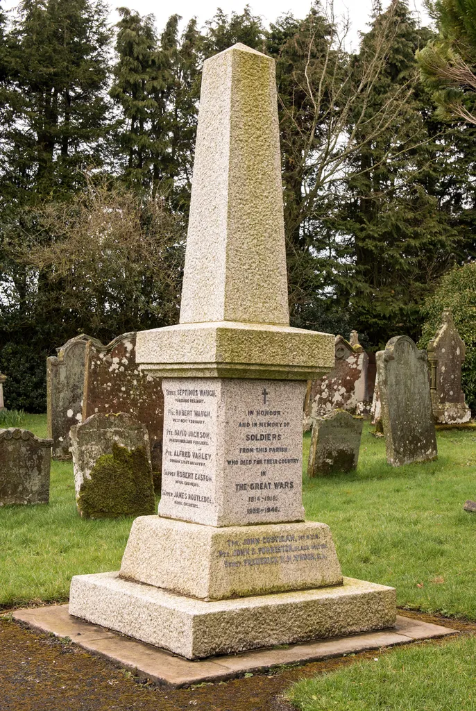 Bewcastle War Memorial in the churchyard of St Cuthbert's Church, Bewcastle, Cumbria, England