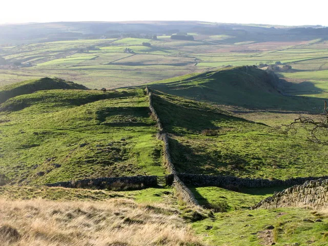 Hadrian's Wall above Milecastle 41 According to magicmap (at 1:5000) the milecastle, beyond the fence in the dip, is not the obvious rectangle outlined in deep shadow but the fainter one just beyond.