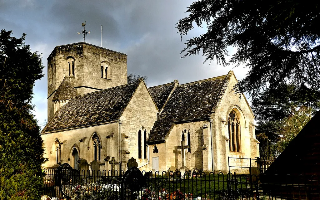 Location: Swindon Village, Gloucestershire, England. Swindon Village is both a village and a suburb in the spa town of Cheltenham. Built in the early 12 Century, St Lawrence is an example of fine Norman architecture. Its main feature of interest is its hexagonal tower and there is only one other six-sided tower to be found in the country. What makes this church unique is that all the six sides of the tower are of unequal size.