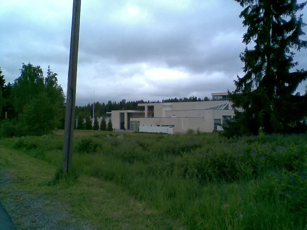The Pirkkala Church in Pirkkala, Finland in the midst of midsummer green. Completed in 1994. Architects: Simo and Käpy Paavilainen.