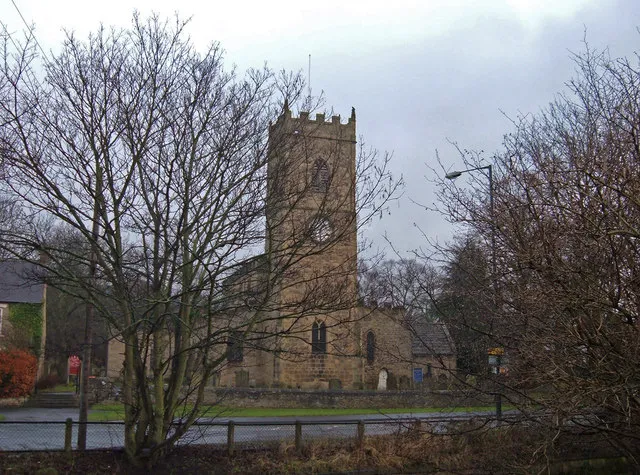 View east across the A691 main road in Lanchester, County Durham, to All Saints' parish church