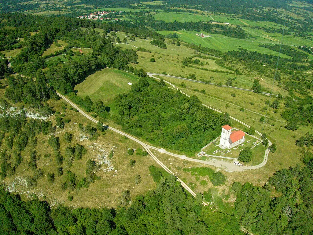 A cute little 11th century gothic church of St. Martin at Šilentabor. The tree lines on the left are hiding something even older - massive ramparts of an Iron Age hill fort. Kite aerial photo, shot with Canon A810 on a Royal 69 sled kite.