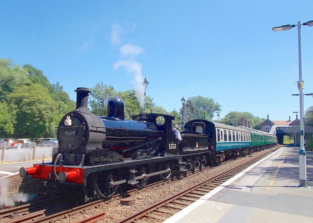 British Railways 0-6-0 Class A No. 52322 is seen at the head of a train at Eridge