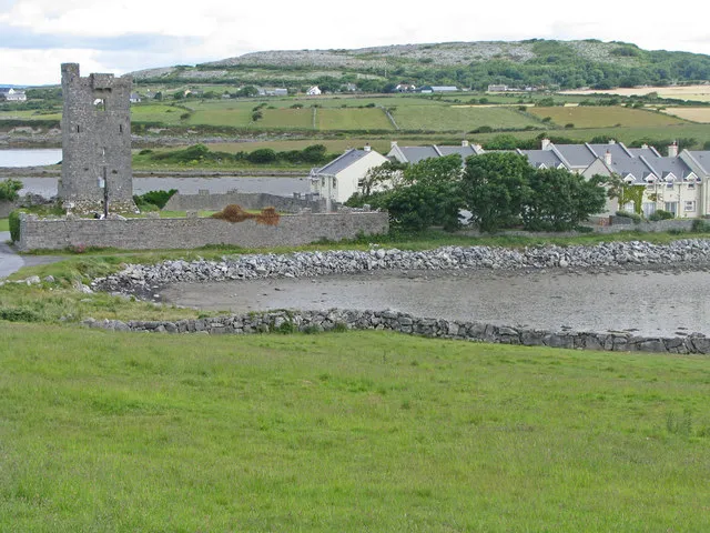 Muckinish Castle encroached upon by modern homes Photo acquired from the roadway edge.