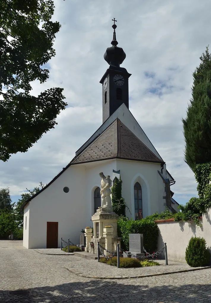 Roman catholic church Saint Vitus and the surrounding cemetery in Kirchstetten, Lower Austria, are protected as a cultural heritage monument. In the front the war memorial.