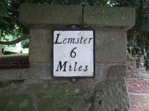 Milestone, by N entrance to churchyard
