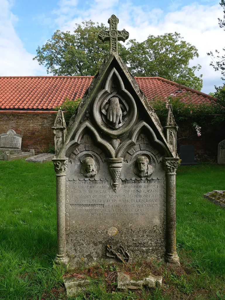 The headstone of Charlotte and Henry Cain outside the Church of Saint Peter, Petersham.