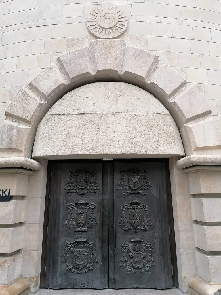 Door to the crypt. Cathedral Katowice, Poland. Bronze. Tomasz Wenklar.